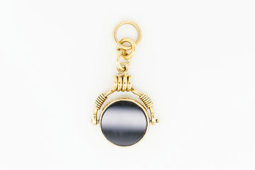 Antique pendant with onyx and shield