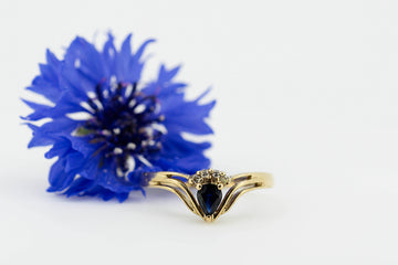 9ct Yellow Gold Ring With Pear Shaped Blue Sapphire Stone Accompanied by Accent Stones #27898-6