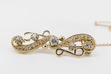 ANTIQUE 10CT GOLD BROACH WITH OLD MINE CUT DIAMONDS