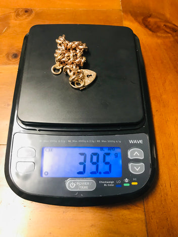 9ct Rose gold hollow curb padlock bracelet.