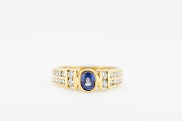 Blue sapphire and diamonds set in an 18ct gold ring.