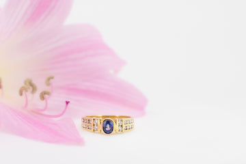 Blue sapphire and diamonds set in an 18ct gold ring.
