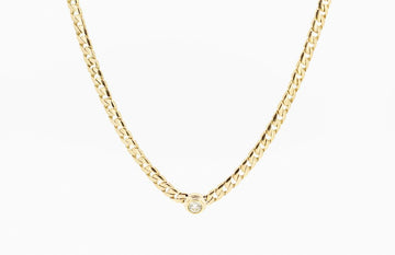 Diamond encased on a solid 9ct gold chain.