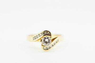 Yellow gold ring is 18ct with diamonds