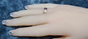 Blue sapphire and diamonds set in an 18ct gold ring.