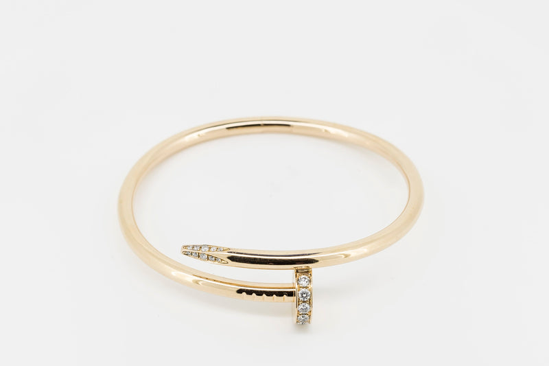 Sold at Auction: Cartier . An 18 carat gold locking bracelet by Cartier,  opened with a key,