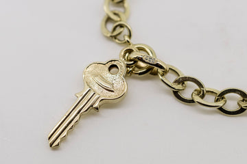 14ct solid yellow gold bracelet with key pendant