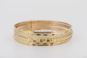 18ct yellow gold, joined multi bangle set of seven