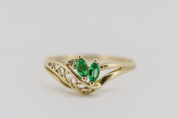 9ct solid yellow gold ring with a diamond and two synthetic emeralds