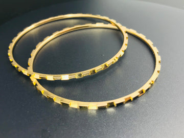 Two 21ct solid gold bangles